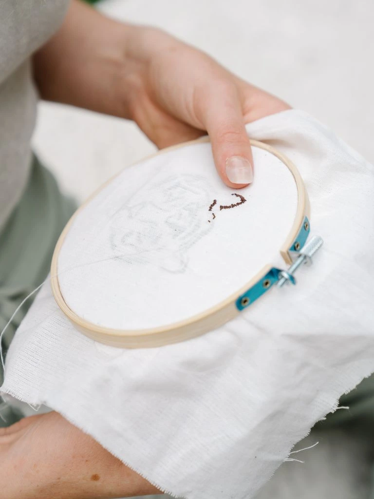 Embroidered patch on a slate gray work jacket